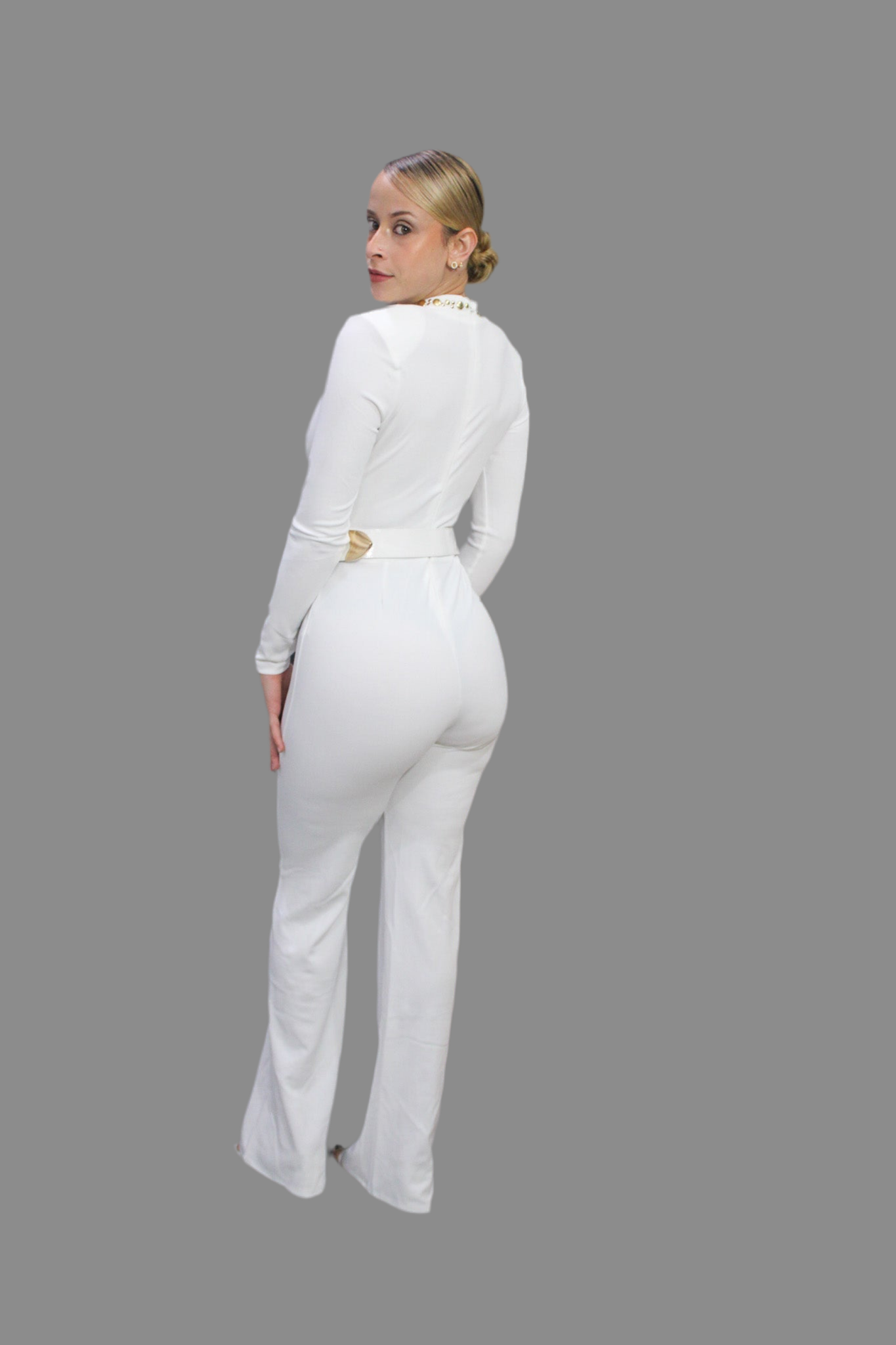 Elegant jumpsuit featuring long sleeves and gold details on the neckline